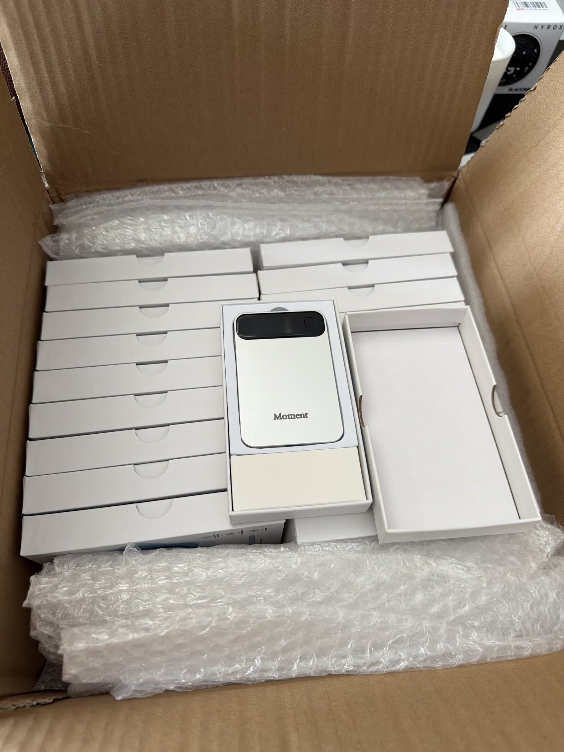 A box of packaged Moment Pro samples